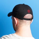 Red Stay Paid Logo on Black Hat