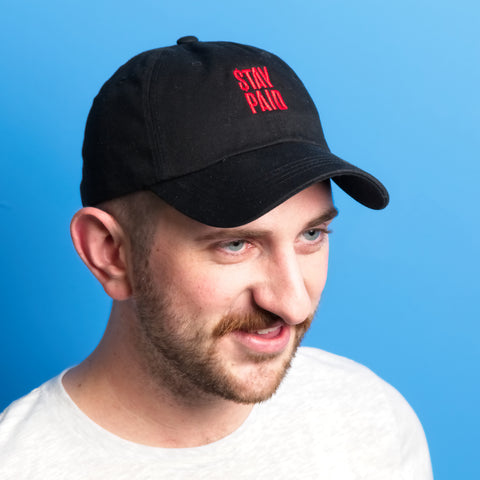 Red Stay Paid Logo on Black Hat